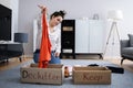 Woman Decluttering Clothes, Sorting