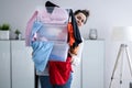 Woman Decluttering And Doing Laundry