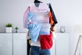 Woman Decluttering And Doing Laundry