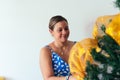 Woman decorate the Christmas tree