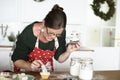 Woman decorating cupcakes for Christmas Royalty Free Stock Photo