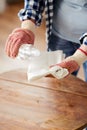 woman degreasing old table surface with solvent Royalty Free Stock Photo