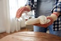 woman degreasing old table surface with solvent Royalty Free Stock Photo