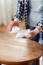 woman degreasing old table surface with solvent Royalty Free Stock Photo