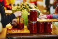 Woman degusting olive oil and sauces on market Royalty Free Stock Photo