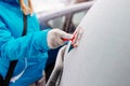 Woman deicing rear car windshield Royalty Free Stock Photo