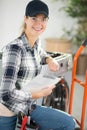 woman delivering new washing machine