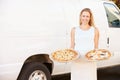 Woman Delivering Pizza Standing In Front Of Van Royalty Free Stock Photo