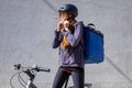 woman delivery person preparing to ride bicycle