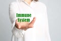 Woman demonstrating word Immunity on light background, closeup Royalty Free Stock Photo