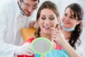 Woman after dental bleaching at dentist