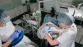 Woman at dentist clinic gets dental treatment to fill a cavity in a tooth. Dental restoration and composite material