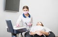 Woman dentist with female patient before treatment in the modern dental office Royalty Free Stock Photo