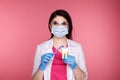 Woman dentist with gloves showing on a jaw model how to clean the teeth with tooth brush properly and Royalty Free Stock Photo