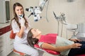 Woman dentist in her office treating female patient Royalty Free Stock Photo