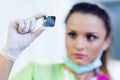 Woman dentist looking at a dental radiography