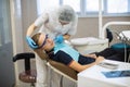 Woman dentist with a patient guy portrait in dental room