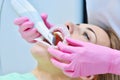 Woman dentist using dental intraoral scanner