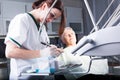 Woman dentist on work with a elder patient in dental clinic