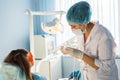 Woman dentist at work with patient Royalty Free Stock Photo