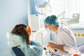 Woman dentist at work with patient Royalty Free Stock Photo