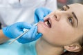 Woman in dentistry demonstrating teeth to doctor