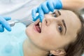 Woman in dentistry demonstrating teeth to doctor