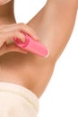 Woman with deodorant stick under her armpit Royalty Free Stock Photo