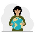 A woman deposits the planet Earth in his hand. Earth day holiday concept, saving the planet, global warming or climate