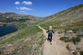 Woman descending King Lake Trail in Indian Peaks Wilderness, Colorado. Royalty Free Stock Photo