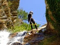Woman descending on rappel Royalty Free Stock Photo