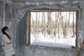 Woman in destroyed house wintertime Royalty Free Stock Photo
