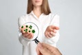 Woman detecting bacteria with magnifying glass on background, closeup. Prevention disease