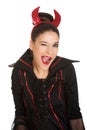 Woman in devil costume blinks eye.