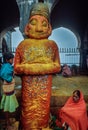 A woman devotee paying her respects to lord Khandoba at the Jejuri temple , Pune