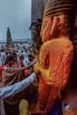 A woman devotee paying her respects to lord Khandoba at the Jejuri temple , Pune