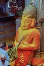 A woman devotee paying her respects to lord Khandoba at the Jejuri temple , Pune