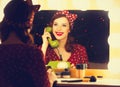 Woman with dial phone applying cosmetics Royalty Free Stock Photo