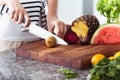 Woman on diet cutting fruit Royalty Free Stock Photo