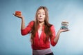 Woman with diet weight loss pills and grapefruit. Royalty Free Stock Photo