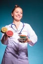 Woman with diet weight loss pills and grapefruits. Royalty Free Stock Photo