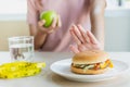 Woman on dieting for good health concept. Woman doing cross arms sign to refuse junk food or fast food.