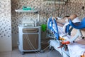 Woman with difficult delivery lying on birthing chair with strong abdominal pain, maternity clinic