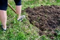 Woman digging garden beds Royalty Free Stock Photo