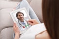Woman With Digital Tablet Having Online Video Call With Her Doctor Royalty Free Stock Photo