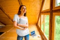 Woman with digital tablet in wooden house Royalty Free Stock Photo
