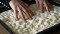 Woman Dimpling Focaccia Dough Royalty Free Stock Photo