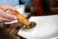 Woman dipping Shrimp Spring Roll into sauce Royalty Free Stock Photo