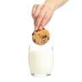Woman dips cookies in a glass of milk isolated on white background