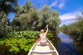 Woman discovering Delta Dunarii by boat Royalty Free Stock Photo